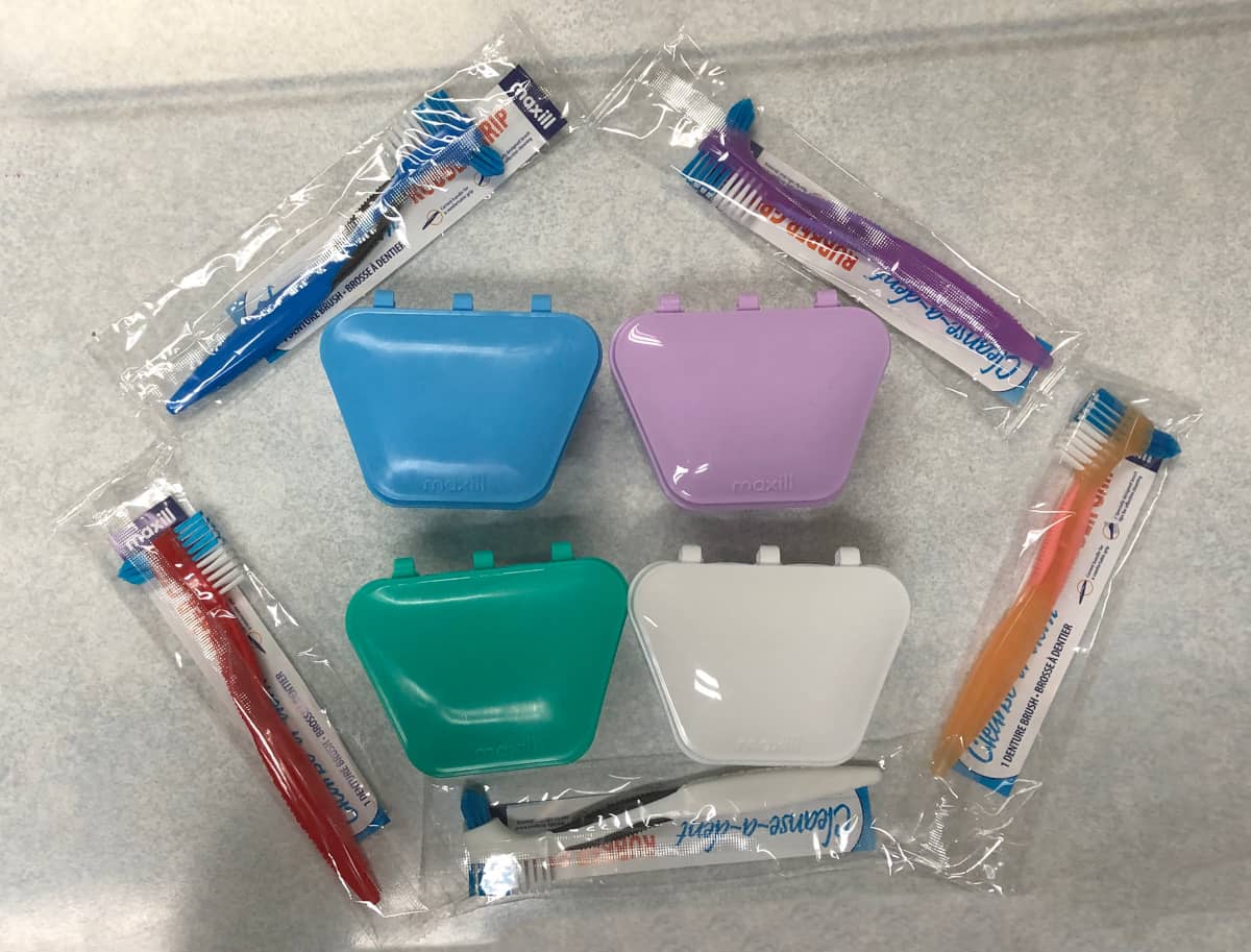 Multiple choices of different coloured denture bath containers and denture brushes
