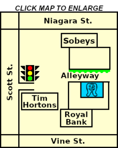 Simple graphical map of Grantham Shopping Plaza in between Niagara, Scott and Vine Streets, showing our location (with our tooth logo) in the garden alleyway, a stoplight graphic at the plaza driveway and where Sobeys, Tim Hortons and Royal Bank are, and an instruction to click the map to enlarge it