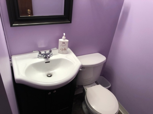 Closeup of our new bathroom sink, toilet and mirror